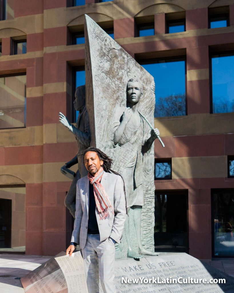 Elio Villafranca with the statue of Cinqué at the Amistad Memorial in New Haven, CT