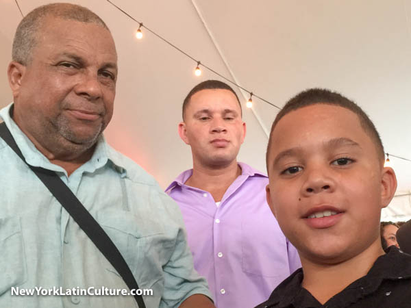 Dominican Day Parade board member Leonardo Ivan Dominguez with young accordionist Diomedes Espinal