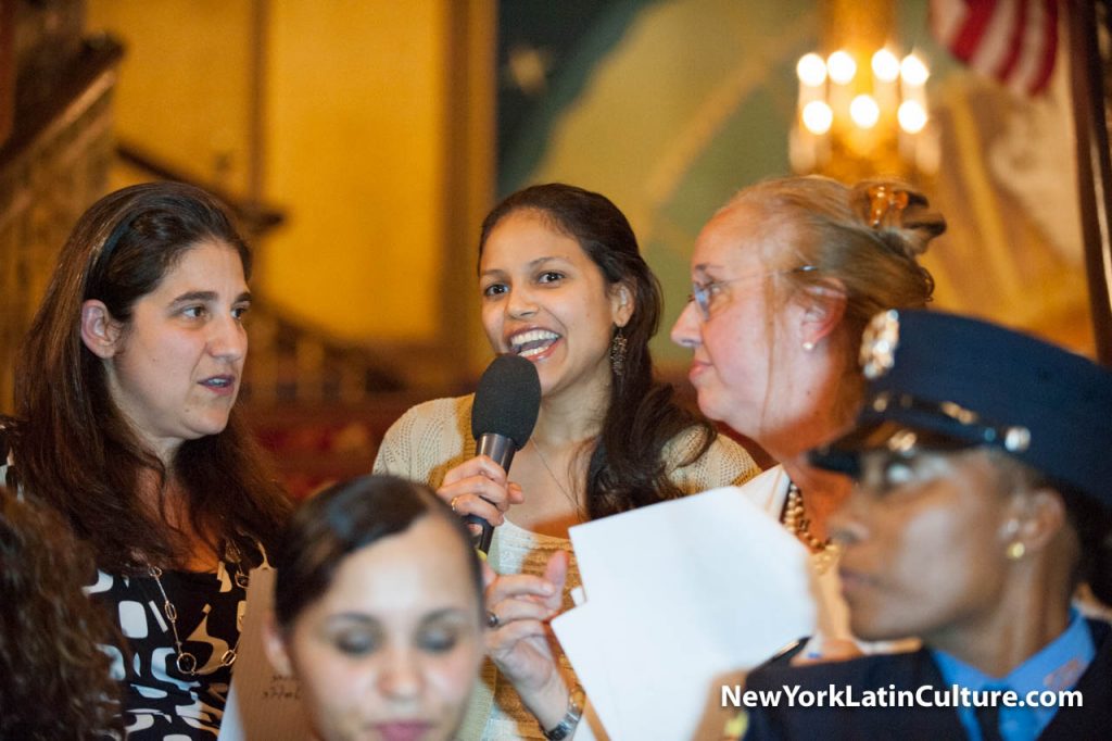 Fatima Hernandez, Dominican Day Parade Scholarship winner gets the attention of Parade Chair Angela Fernandez & Manhattan Borough President Gale A. Brewer