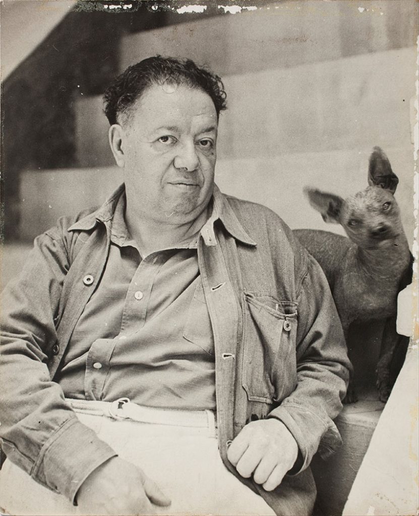 Mexican artist Diego Rivera with a Xoloitzcuintli at Casa Azul