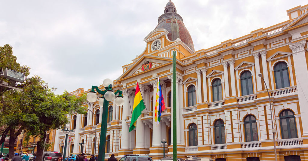 The two flags of Bolivia on the Congress in La Paz (Dmitriyrnd/Dreamstime)