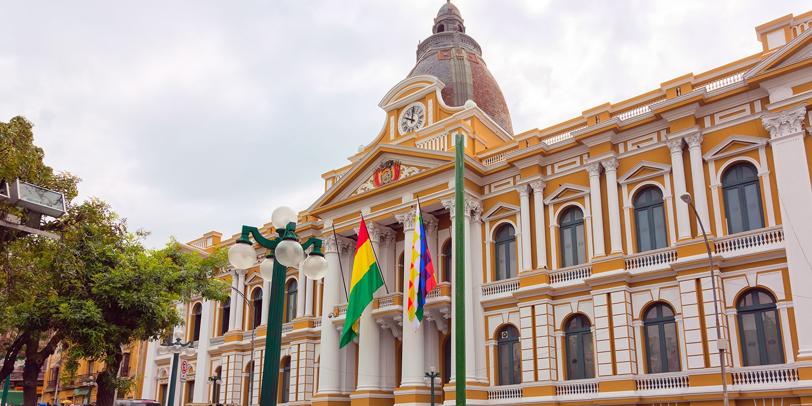 The two flags of Bolivia on the Congress in La Paz (Dmitriyrnd/Dreamstime)