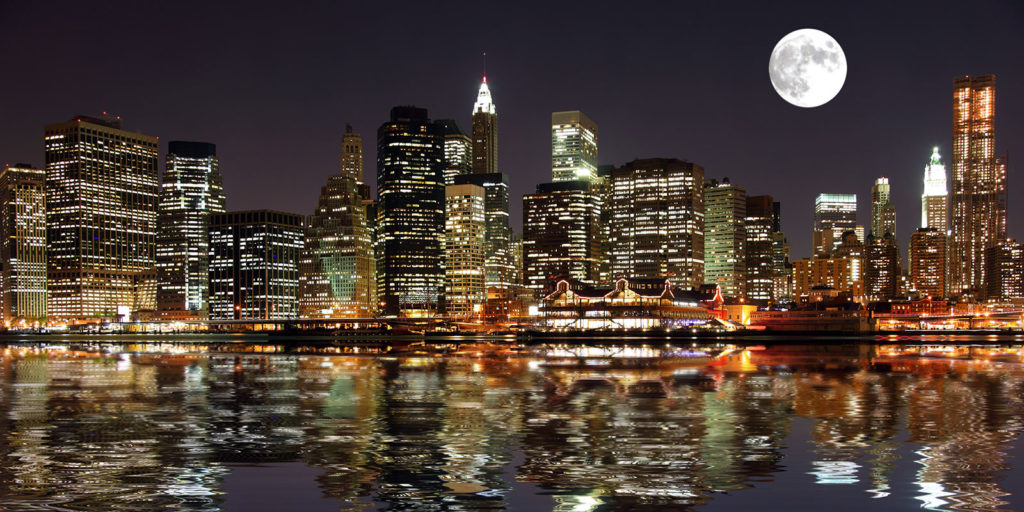 The Sturgeon Moon rises over the old South Street Seaport (Stuart Monk/Adobe)