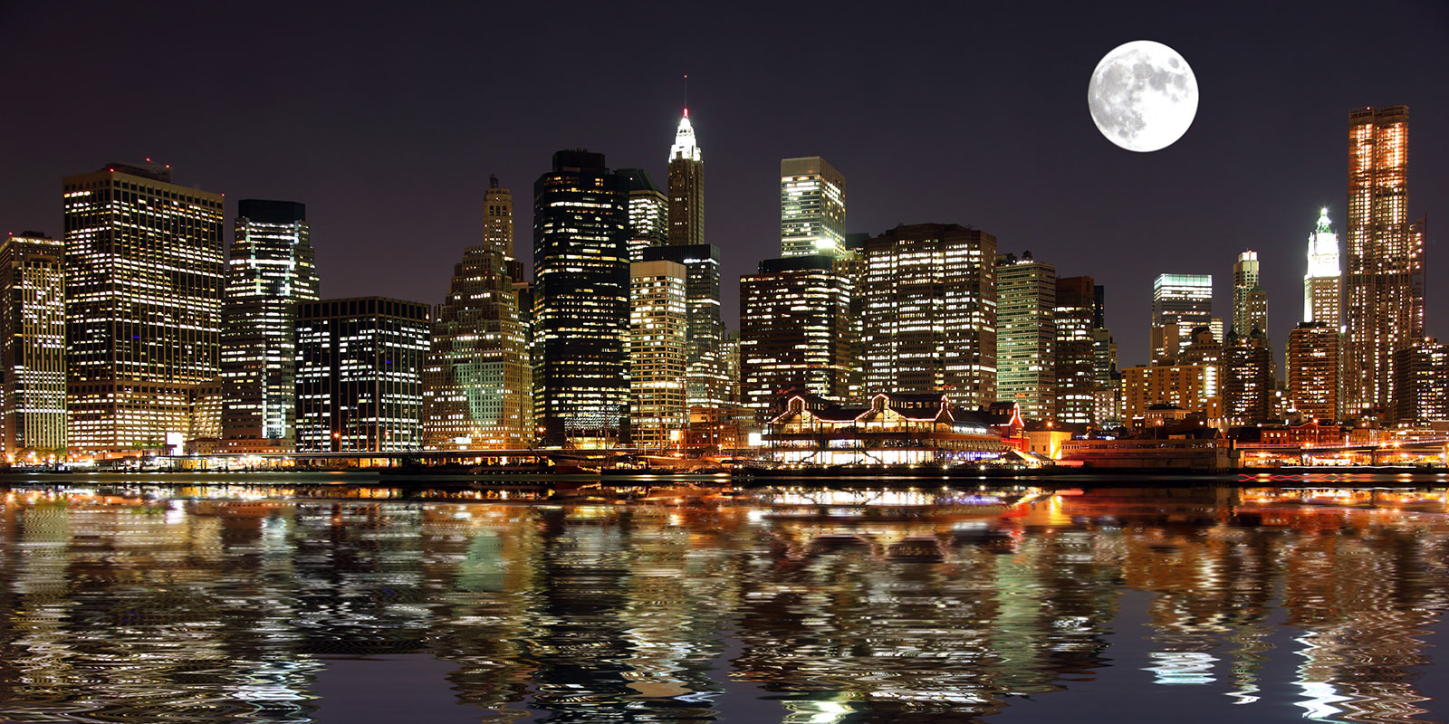 The Sturgeon Moon rises over the old South Street Seaport (Stuart Monk/Adobe)