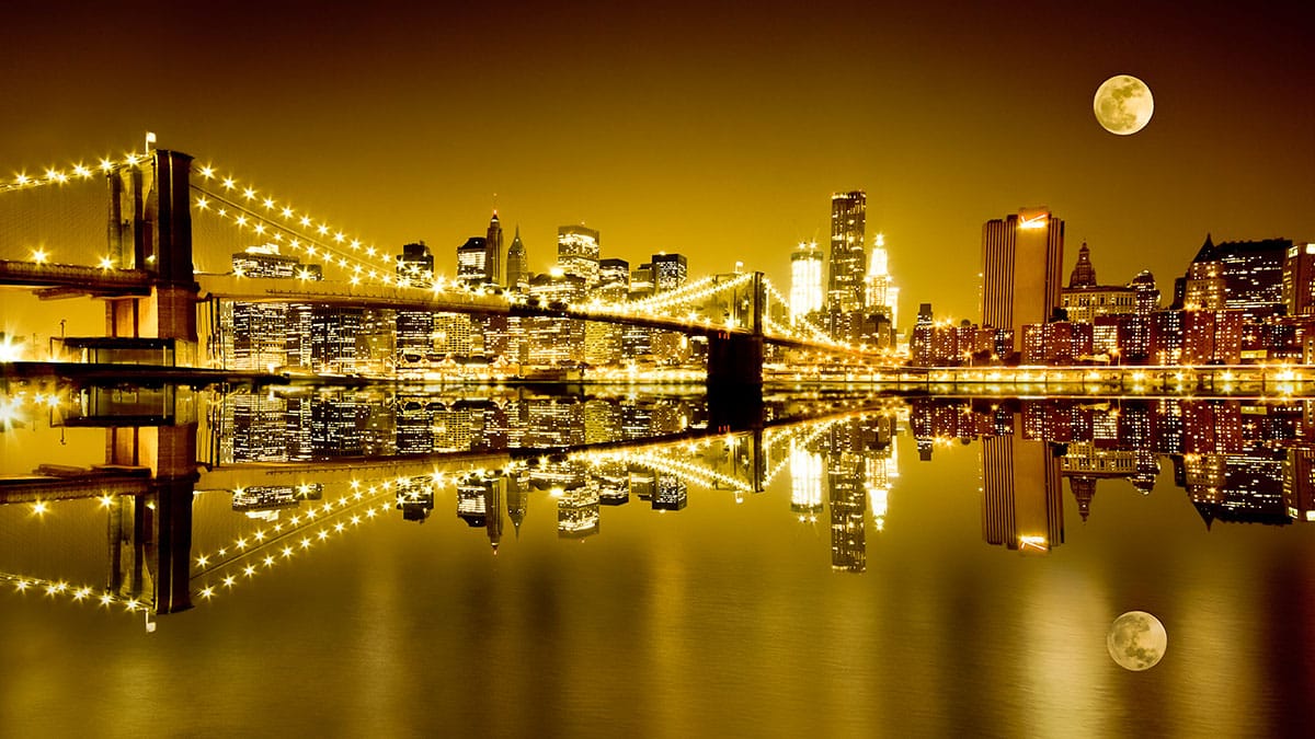 The Harvest Moon full moon rises over the Two Bridges neighborhood (LittleNY/Dreamstime)